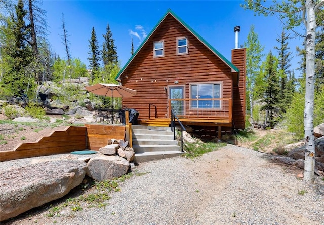 216 Ambush Ln, Jefferson, CO 80456 - back of property featuring a chimney