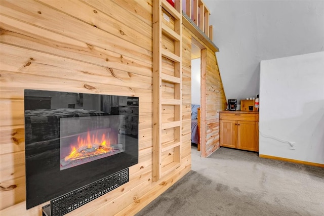 216 Ambush Ln, Jefferson, CO 80456 - detailed view of a lit fireplace and carpet flooring