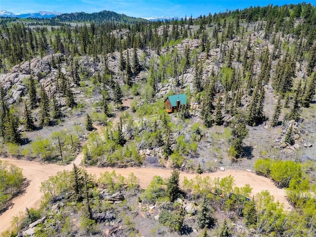 216 Ambush Ln, Jefferson, CO 80456 - bird's eye view of a heavily wooded area and a mountain backdrop