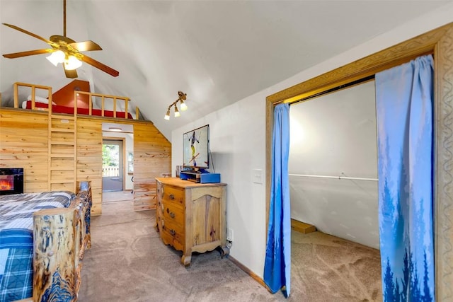216 Ambush Ln, Jefferson, CO 80456 - bedroom with carpet, lofted ceiling, and wooden walls