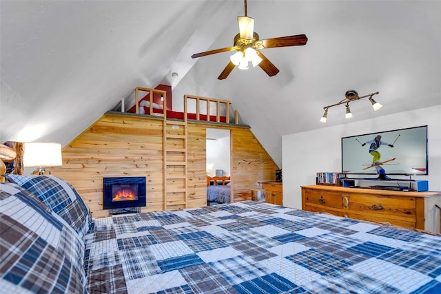 216 Ambush Ln, Jefferson, CO 80456 - bedroom featuring lofted ceiling and wood walls