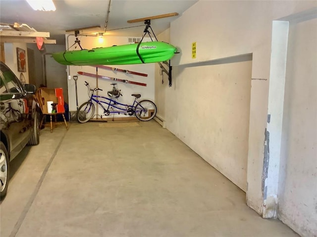 storage area with a garage and visible vents