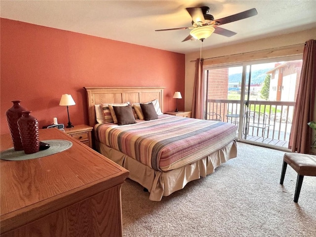 bedroom featuring light colored carpet, a ceiling fan, and access to outside