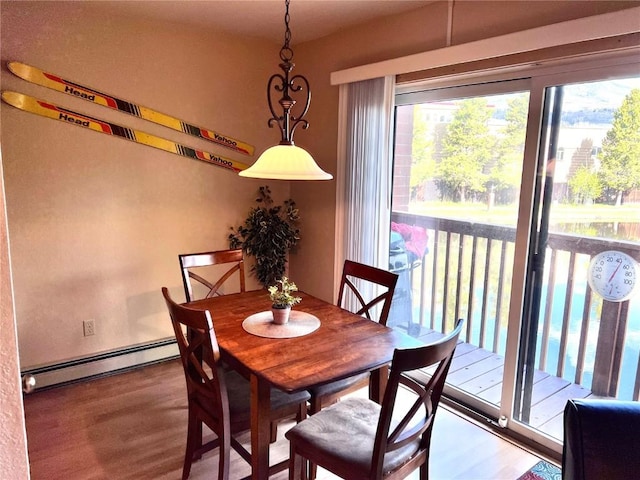 720 Lagoon Dr Unit D, Frisco, CO 80443 - dining space with baseboard heating and wood finished floors