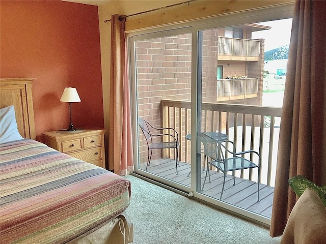 carpeted bedroom with access to outside