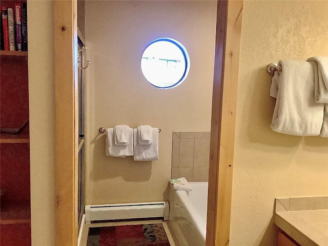 full bath with a bath, baseboard heating, and an enclosed shower