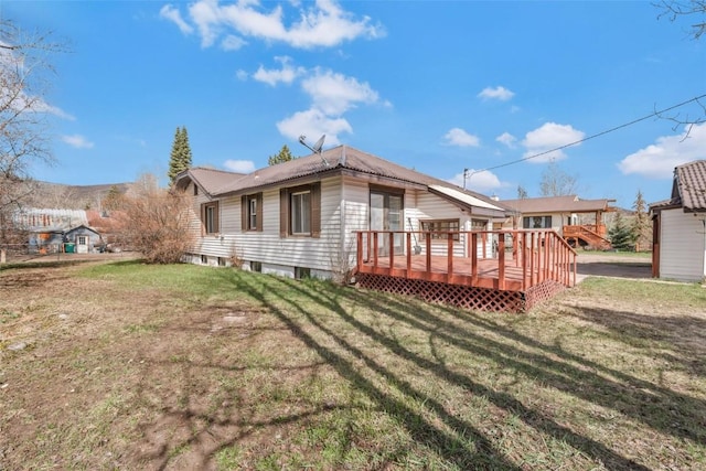 401 Moffat Ave, Oak Creek, CO 80467 - rear view of house with a wooden deck and a yard