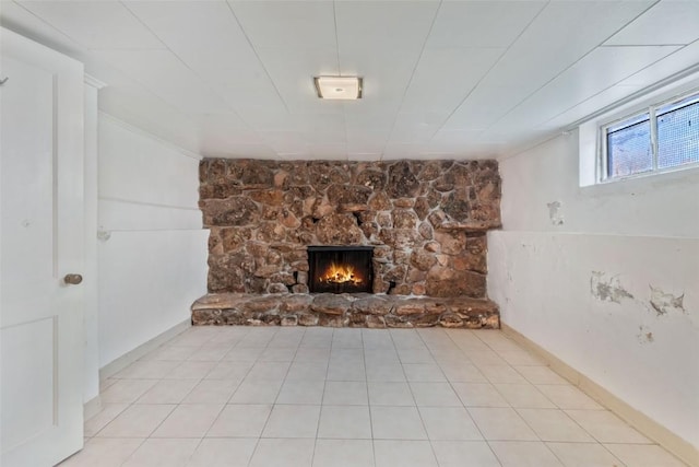 401 Moffat Ave, Oak Creek, CO 80467 - unfurnished living room featuring a stone fireplace and tile patterned flooring