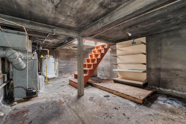 401 Moffat Ave, Oak Creek, CO 80467 - unfinished basement featuring heating unit and stairs