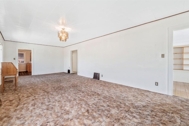 401 Moffat Ave, Oak Creek, CO 80467 - empty room with carpet and a chandelier