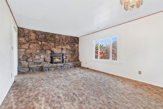 401 Moffat Ave, Oak Creek, CO 80467 - unfurnished living room with a wood stove and carpet
