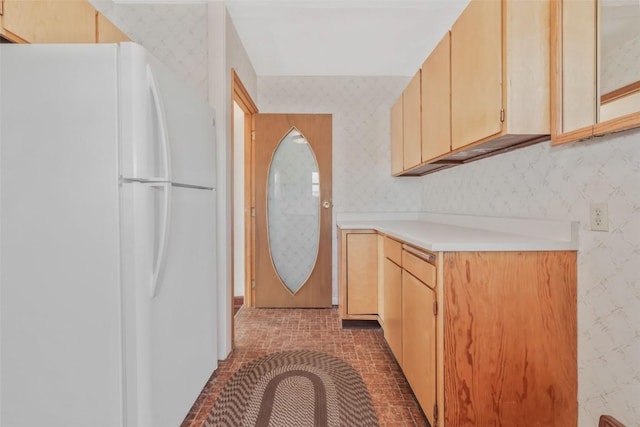 401 Moffat Ave, Oak Creek, CO 80467 - laundry room with wallpapered walls and brick patterned flooring