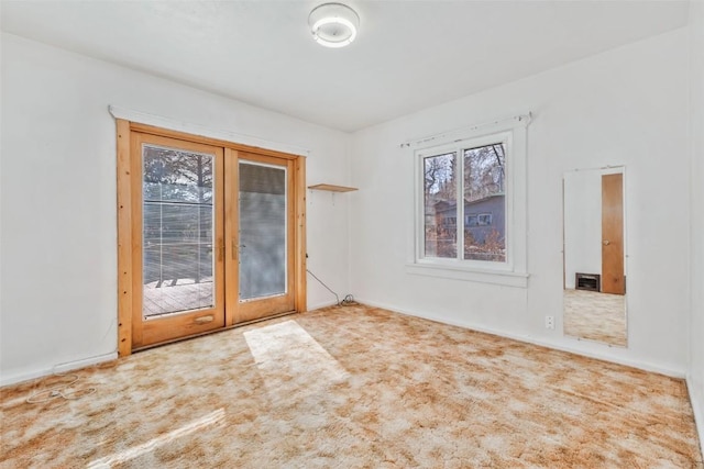 401 Moffat Ave, Oak Creek, CO 80467 - carpeted empty room featuring healthy amount of natural light and french doors