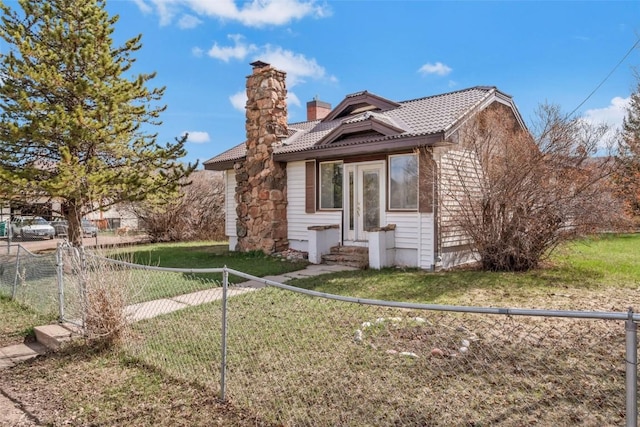 401 Moffat Ave, Oak Creek, CO 80467 - rear view of house featuring entry steps, a chimney, and a tile roof