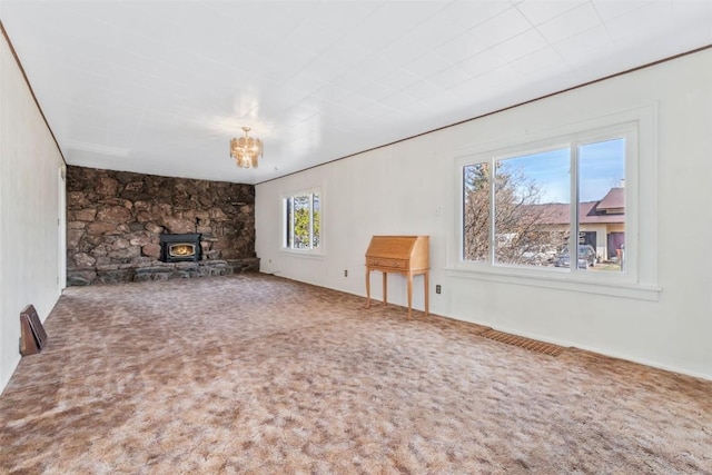 401 Moffat Ave, Oak Creek, CO 80467 - unfurnished living room with a wood stove and carpet flooring