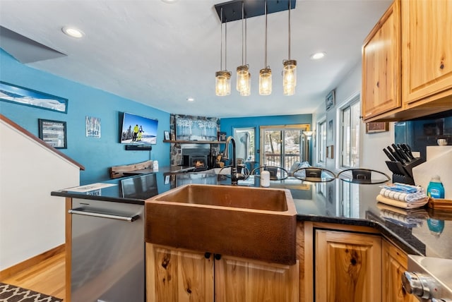 876 Broken Lance Dr Unit 876, Breckenridge, CO 80424 - kitchen featuring a sink, pendant lighting, wood finished floors, recessed lighting, and open floor plan