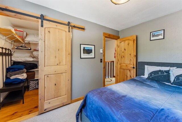876 Broken Lance Dr Unit 876, Breckenridge, CO 80424 - carpeted bedroom featuring a barn door