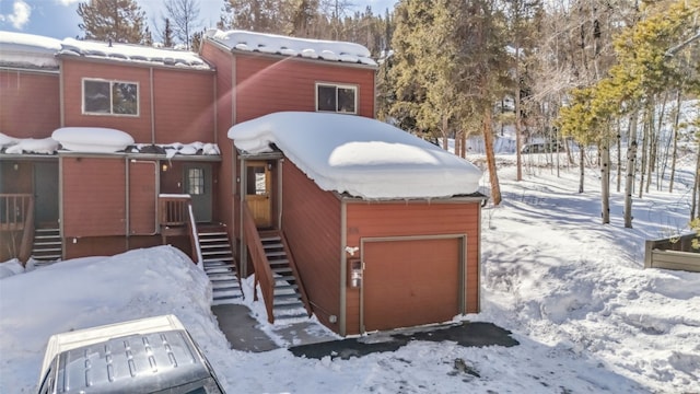 876 Broken Lance Dr Unit 876, Breckenridge, CO 80424 - yard layered in snow with an attached garage