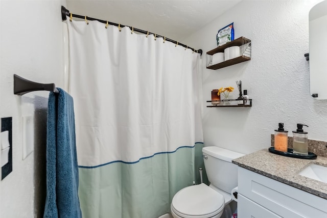 full bathroom with a shower with curtain, a textured wall, vanity, and toilet