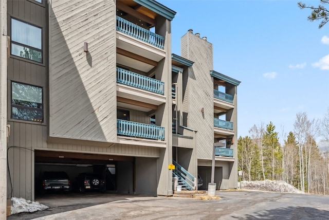 view of building exterior with a garage and driveway
