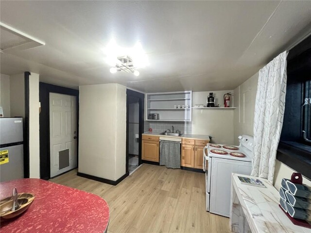 205 Arthur Ave, Oak Creek, CO 80467 - kitchen with stainless steel appliances, open shelves, light wood-style floors, and light countertops