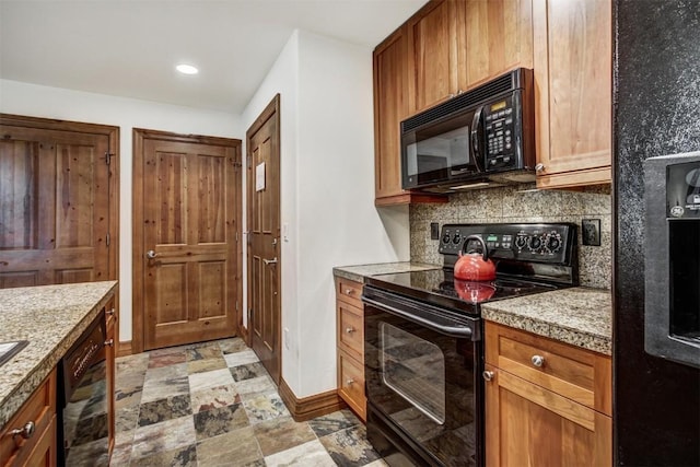 kitchen with black appliances, decorative backsplash, baseboards, brown cabinets, and light countertops
