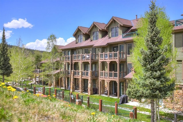 view of property featuring fence
