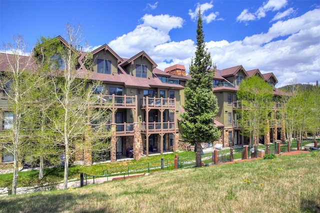 view of building exterior featuring fence
