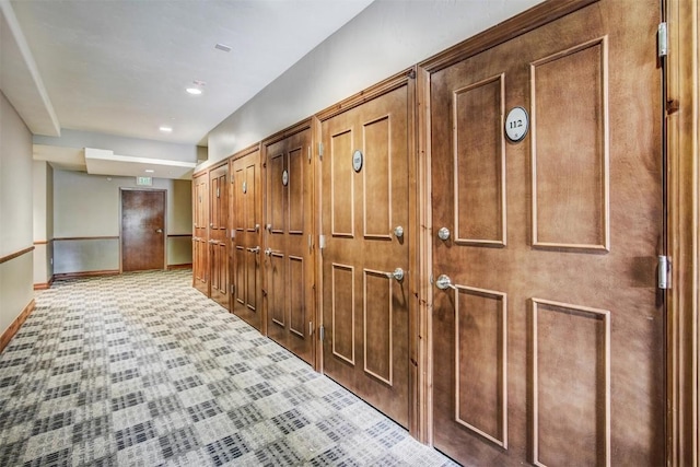 hallway with baseboards and recessed lighting