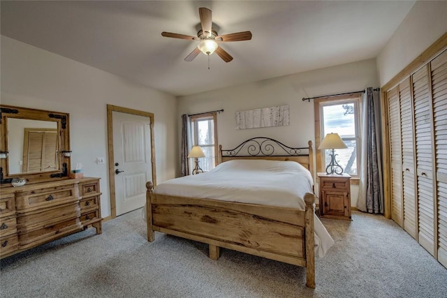 3222 Middle Fork Vis, Fairplay, CO 80440 - bedroom with light carpet, multiple windows, and a ceiling fan
