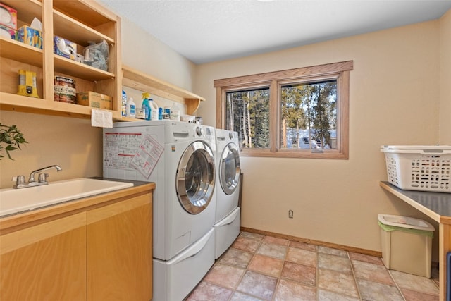 284 Lakeshore Loop, Blue River, CO 80424 - washroom featuring washer and clothes dryer, baseboards, and light stone finish flooring