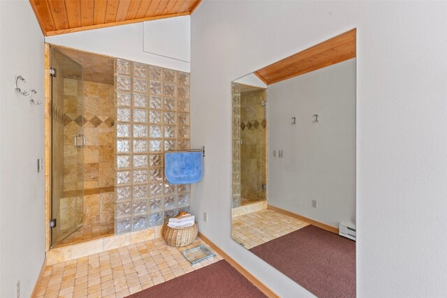 284 Lakeshore Loop, Blue River, CO 80424 - bathroom with baseboard heating, a shower stall, wood ceiling, and lofted ceiling