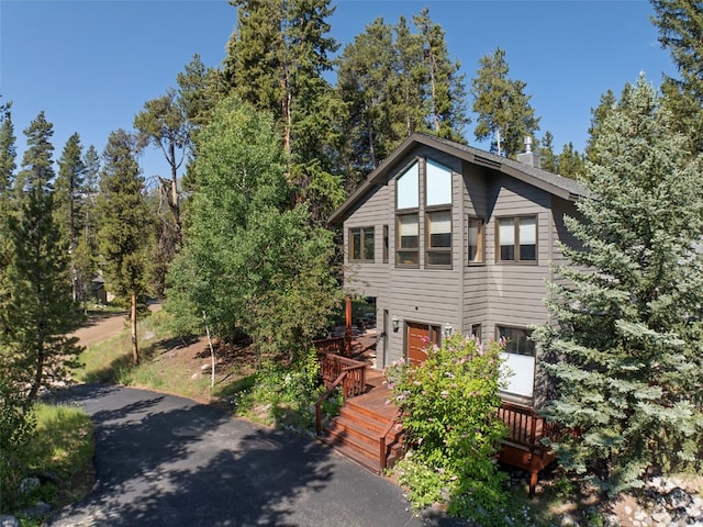 284 Lakeshore Loop, Blue River, CO 80424 - view of front of house featuring a wooden deck and a chimney