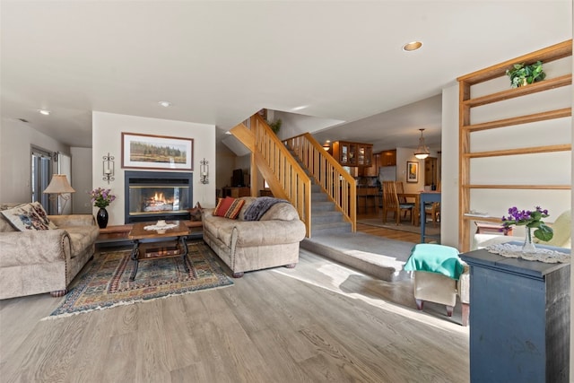 284 Lakeshore Loop, Blue River, CO 80424 - living area featuring stairs, wood finished floors, a glass covered fireplace, and recessed lighting
