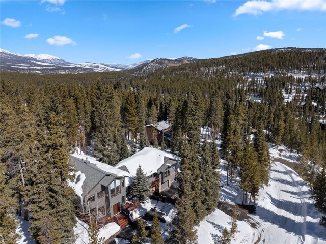 284 Lakeshore Loop, Blue River, CO 80424 - snowy aerial view featuring a view of trees and a mountain view