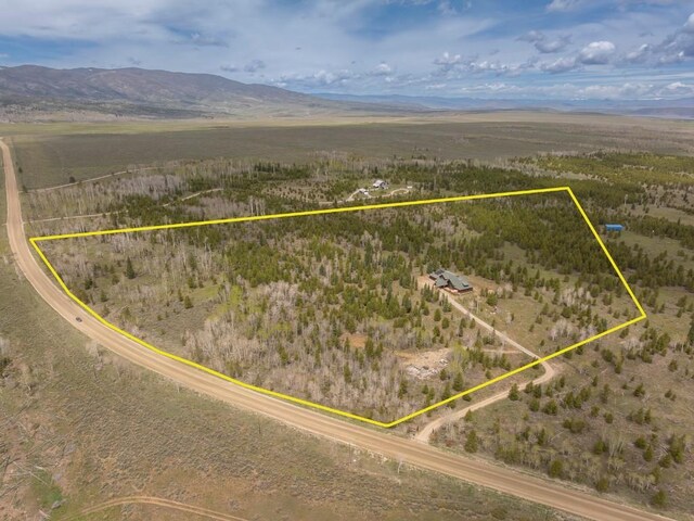 12000 Ute Pass Rd, Parshall, CO 80468 - aerial view of sparsely populated area with property boundaries highlighted and a mountain backdrop