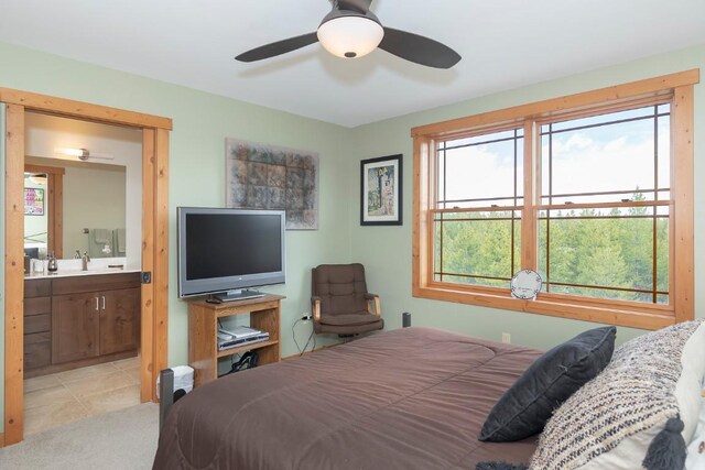 12000 Ute Pass Rd, Parshall, CO 80468 - bedroom featuring a sink, connected bathroom, light tile patterned flooring, and ceiling fan