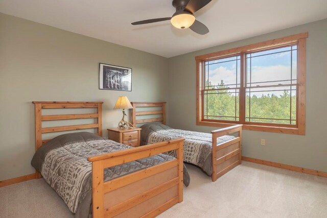 12000 Ute Pass Rd, Parshall, CO 80468 - carpeted bedroom with baseboards and a ceiling fan