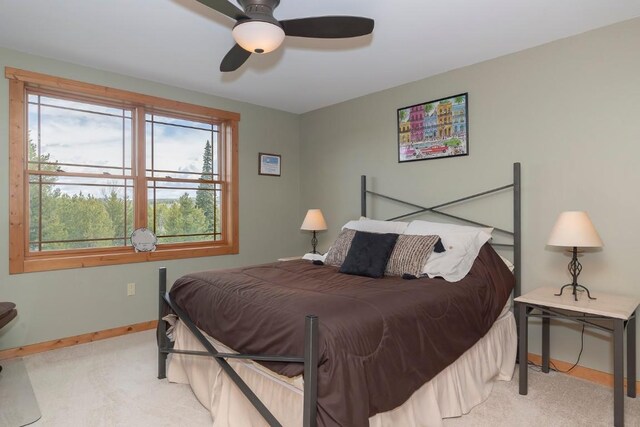 12000 Ute Pass Rd, Parshall, CO 80468 - carpeted bedroom featuring baseboards and ceiling fan