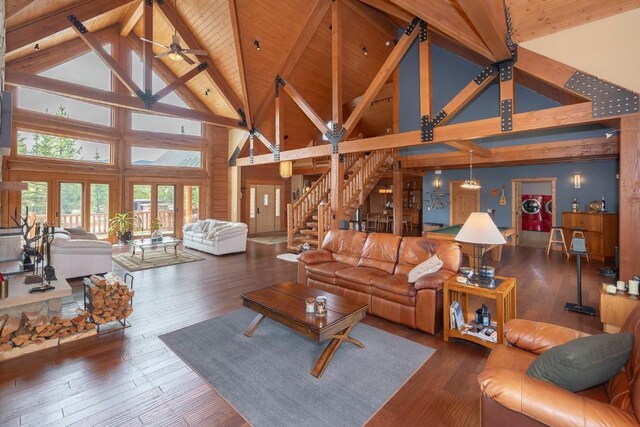 12000 Ute Pass Rd, Parshall, CO 80468 - living area featuring high vaulted ceiling, wood ceiling with exposed beams, wood-type flooring, stairway, and ceiling fan