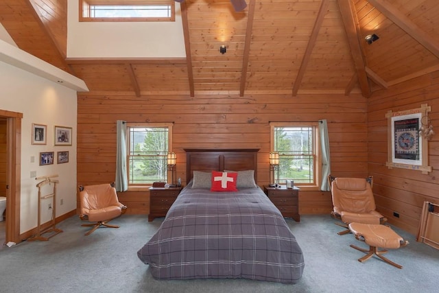 12000 Ute Pass Rd, Parshall, CO 80468 - bedroom with wood ceiling with exposed beams, multiple windows, carpet, and wooden walls