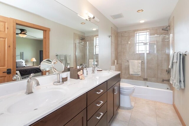12000 Ute Pass Rd, Parshall, CO 80468 - full bathroom featuring connected bathroom, toilet, shower / bath combination, double vanity, and tile patterned flooring