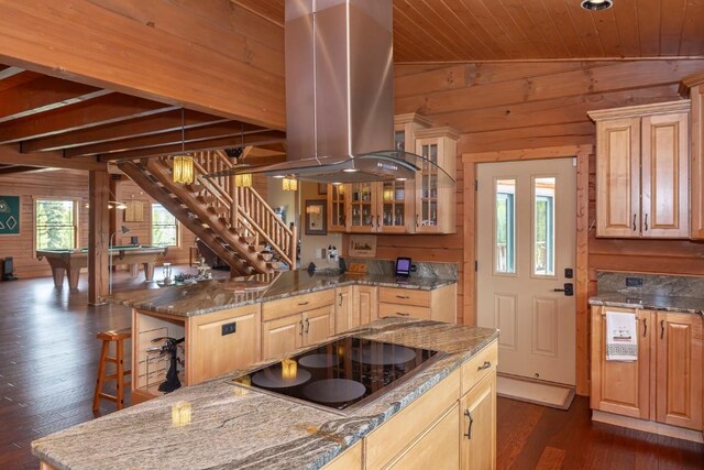 12000 Ute Pass Rd, Parshall, CO 80468 - kitchen with wood walls, black electric cooktop, island range hood, dark wood-style floors, and a breakfast bar area