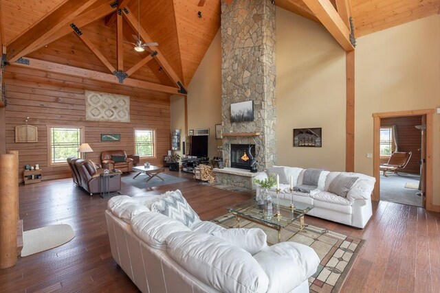 12000 Ute Pass Rd, Parshall, CO 80468 - living room with a fireplace, high vaulted ceiling, wood ceiling with exposed beams, hardwood / wood-style flooring, and a ceiling fan