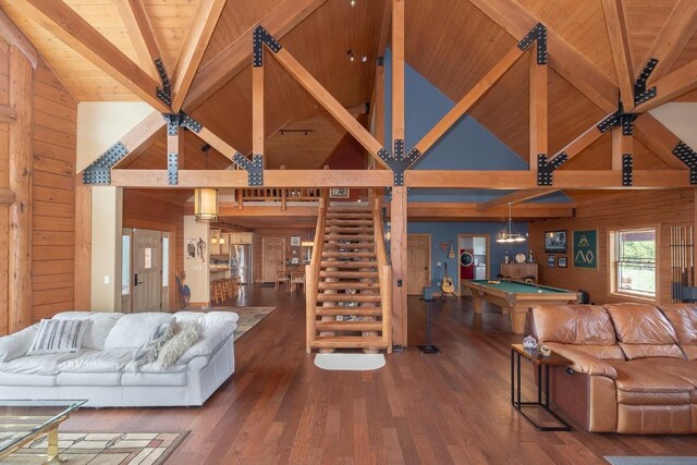 12000 Ute Pass Rd, Parshall, CO 80468 - living area with high vaulted ceiling, wooden ceiling with exposed beams, billiards, wood walls, and wood finished floors
