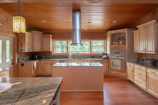 12000 Ute Pass Rd, Parshall, CO 80468 - kitchen featuring appliances with stainless steel finishes, wooden ceiling, light brown cabinets, wood finished floors, and a kitchen island