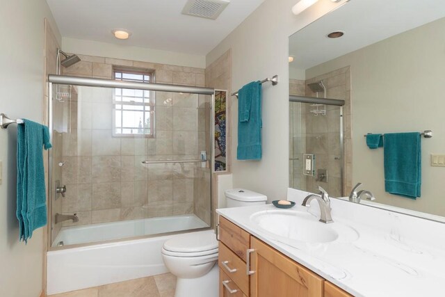 12000 Ute Pass Rd, Parshall, CO 80468 - full bath featuring vanity, toilet, bath / shower combo with glass door, and tile patterned flooring