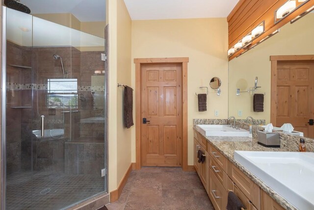 12000 Ute Pass Rd, Parshall, CO 80468 - full bathroom with double vanity, a stall shower, and baseboards