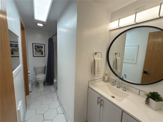 full bath with toilet, tile patterned floors, vanity, and a shower with shower curtain