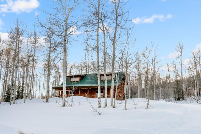57785 Saturn Ct, Clark, CO 80428 - snow covered rear of property featuring metal roof